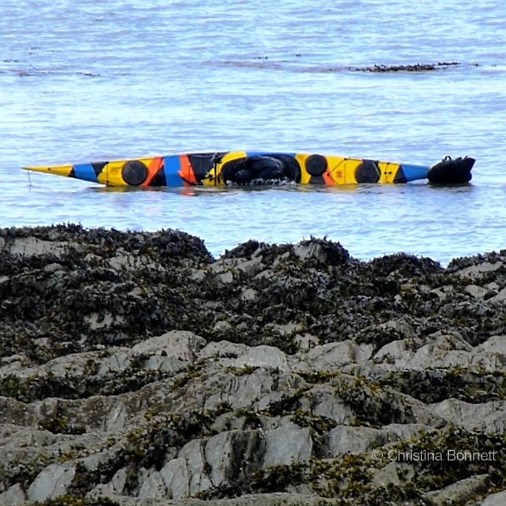 Greenland roll in Dazzle Painted Kayak